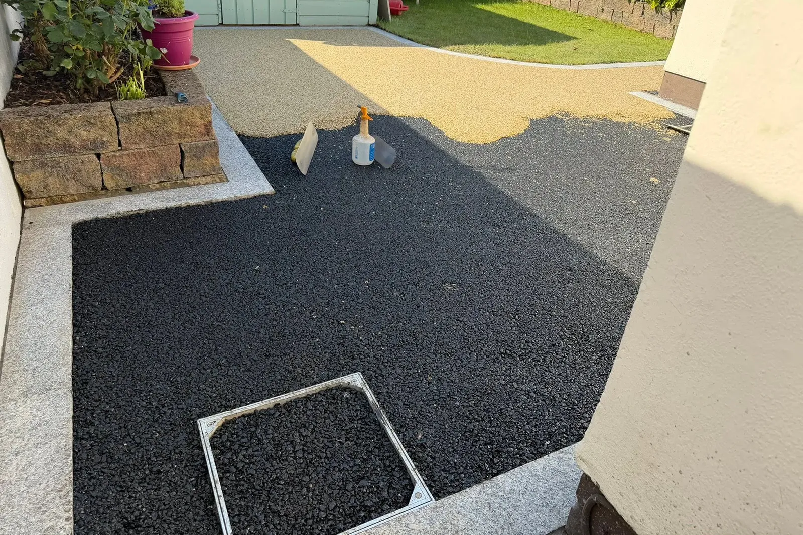 Silver granite border detail around a resin patio in Stone Abbey Dublin 16