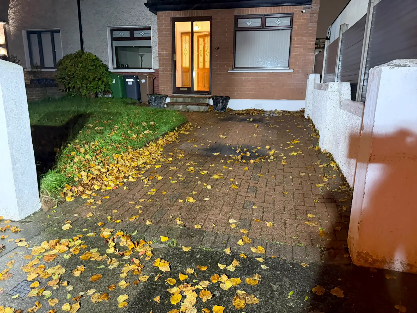 Worn cobblelock driveway and front lawn on Kilnamanagh Road Dublin 12 before replacement
