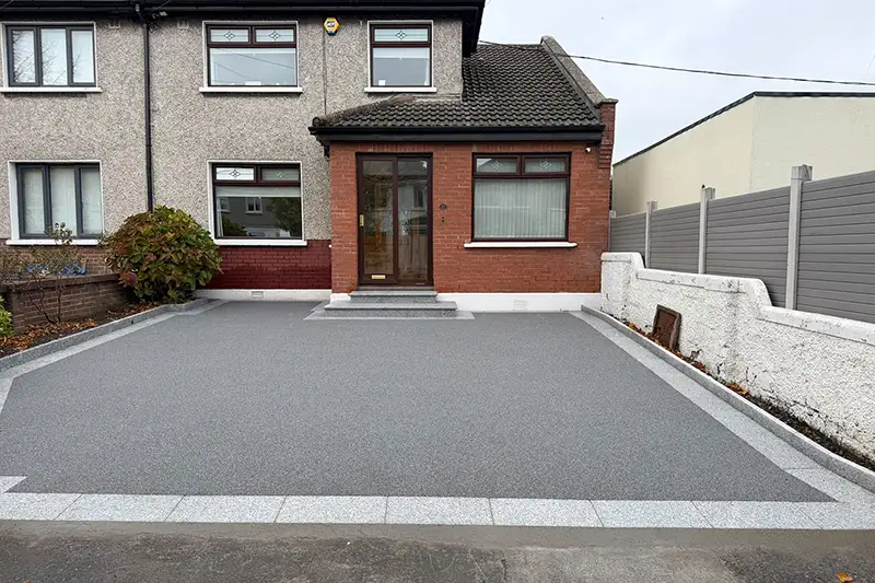 Completed Manhattan International grey resin driveway with silver granite borders and steps on Kilnamanagh Road Dublin 12