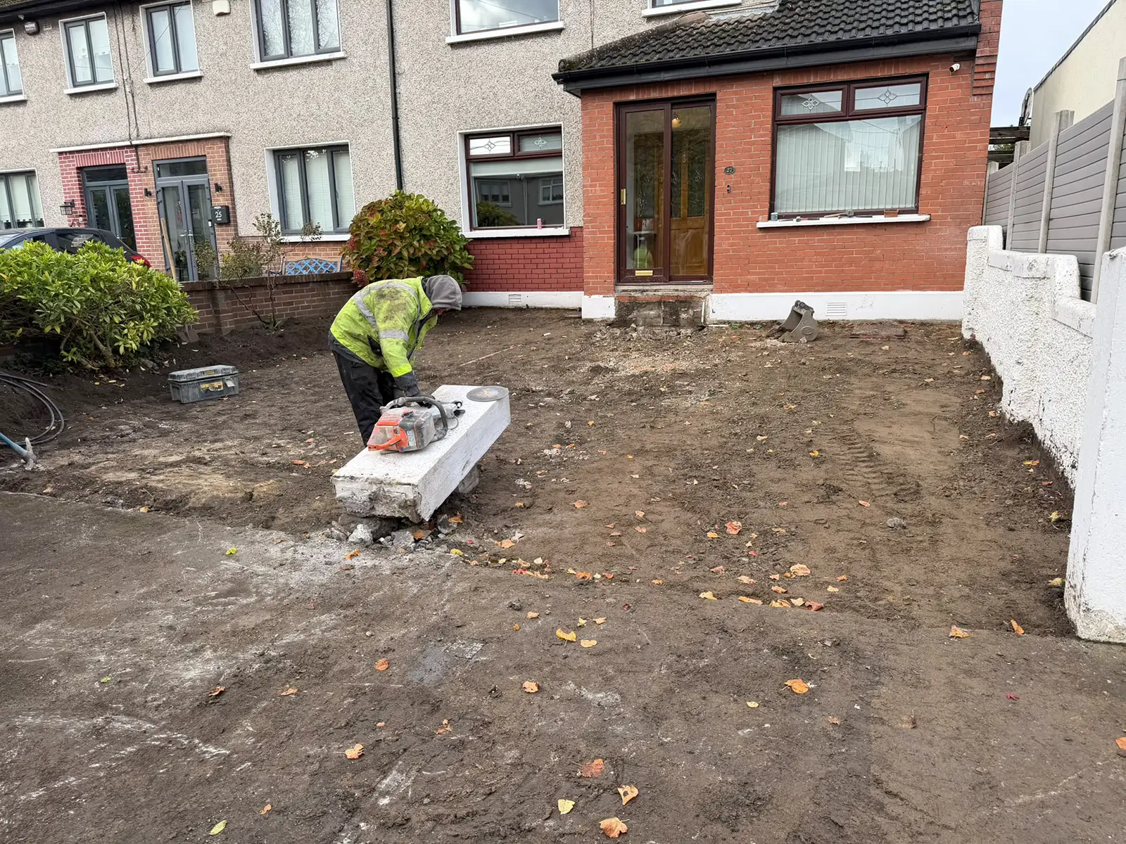 Ground clearance and front wall removal for a larger driveway on Kilnamanagh Road Dublin 12