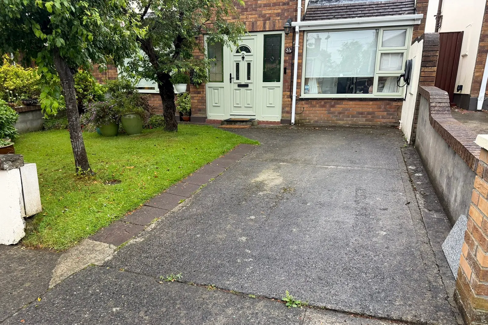 Cracked pavement driveway before resin driveway installation in Templeroan Dublin