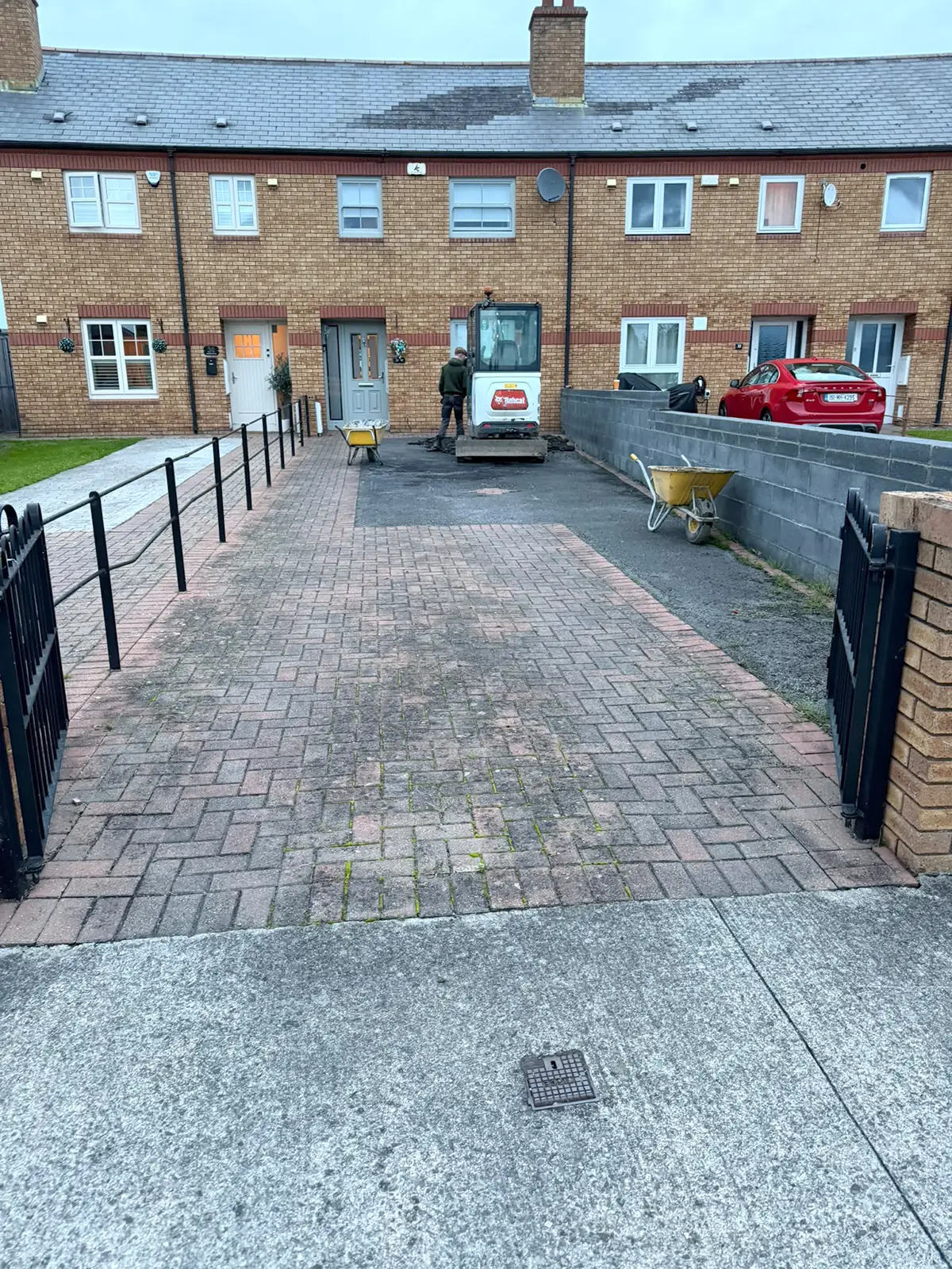 Existing worn cobblelock and deteriorating tarmac driveway in Palmerstown Dublin before replacement