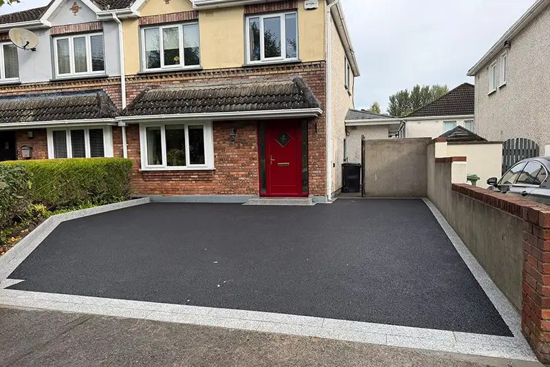 Completed tarmac driveway with granite framing and silver granite planting risers in Rathcurragh Newbridge